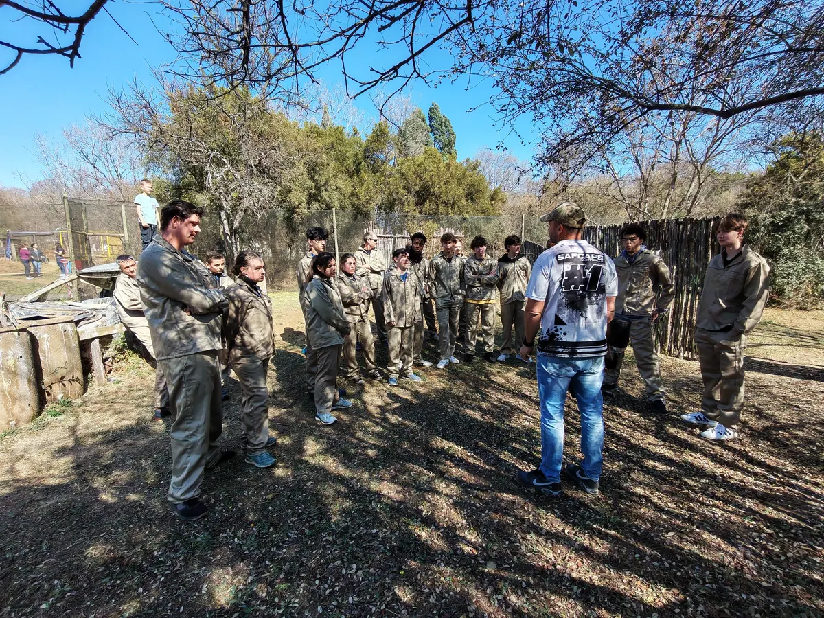 A marshal briefing a group before a paintball session at Legends